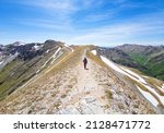 Small photo of Monte Sibilla in Montemonaco, Italy - 21 May 2021 - The landscape summit of Mount Sibilla, in Marche region province of Ascoli Piceno, in the Monti Sibillini mountain park. Here a view with hiker