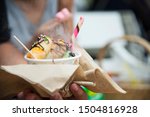 Small photo of Boy eating smoking canny in bucket - people and snack happy time concept