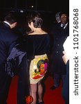 Small photo of Washington DC, USA, December 5, 1993 George Stephanopoulos the White House Director Of Commucations and his date for the evening arrive at the John F. Kennedy Center For The Prefroming Arts