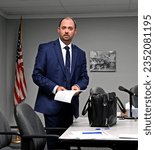 Small photo of MARION, KANSAS, USA - AUGUST 21, 2023 Marion City attorney Brian Bina attending the city council meeting