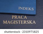 Small photo of index lying on the postgraduate thesis. Translation of the inscription on the smaller book "index" and the inscription "Master's thesis" on the larger one