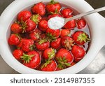 Small photo of Rinsing fresh strawberry fruit in water with the addition of baking soda