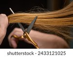 A delicate cut of hair with...