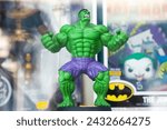 Small photo of Motril, Spain- 17.09.2023: Plastic green Hulk toy stands close-up on a toy store window.
