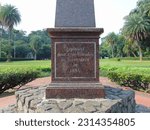 Small photo of a monument in the Bogor Botanical Gardens, where the monument reads "geplaatst dour zyne vrienden en vereerders in 1884". Bogor, Botanical Garden - April 21 2023.