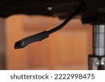 Close-up of office chair height adjustment lever