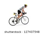 A male bicyclist riding a...