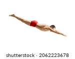 Small photo of Male swimmer in a red swimsuit jumping to dive isolated on white background