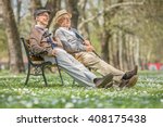 Two Senior Gentlemen Sitting...