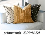 Different coloured pillows with unique patterns 