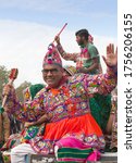 Small photo of BIKANER, INDIA - JANUARY 11, 2020: Rajasthani folk dancers performing on festival in Rajasthan state. The Camel Festival begins with a colourful procession of bedecked camels, musicians and dancers