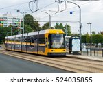 Modern yellow tram in Dresden in a beautiful cloudy autumn day in Dresden, Germany