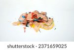 Small photo of Close-up of colorful pencil shavings on a white background. Whole and broken lead pencils on white background. The rest of the pencil. Macro, pile of shavings