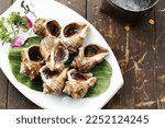 Small photo of Poached Whelks,Seafood dish, Boiled Areola Babylon, Boiled babylonia whelks，Sea Whelks