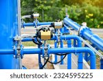 Small photo of Water gate and electric actuator with steel pipe close up image. Select focus of drink water piping. Flange Pipe Fitting