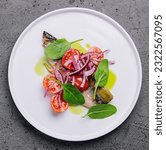 Small photo of Mackerel with cherry tomatoes and red onions