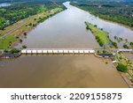 Top view Aerial photo from flying drone over concrete small dam or medium sized dam blocks the Mun River,HUANA DAM Sisaket province,Thailand,ASIA.