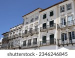 Small photo of Facades of typical buildings at the main square of the city: Praca do Giraldo, Evora, Alentejo, Portugal