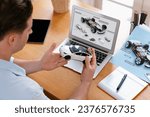 Small photo of Car design engineer analyze car prototype for automobile business at home office. Automotive engineering designer carefully analyze, finding flaws and improvement for car model design. Synchronos