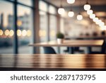 Table with blur background of corporate office conference room with glass interior for office product place on the table defocus office background. The office table made of wood. Corporate room.
