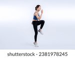 Small photo of Side view young athletic asian woman on running posture in studio shot on isolated background. Pursuit of healthy fit body physique and cardio workout exercise lifestyle concept. Vigorous