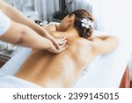 Small photo of Caucasian woman customer enjoying relaxing anti-stress spa massage and pampering with beauty skin recreation leisure in day light ambient salon spa at luxury resort or hotel. Quiescent