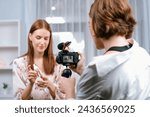 Small photo of Woman influencer shoot live streaming vlog video review makeup utmost social media or blog. Happy young girl with cosmetics studio lighting for marketing recording session broadcasting online.