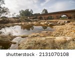 Roman bridge and Rio Tinto in Niebla village Huelva province Andalusia Spain