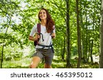 Happy woman hiking in the woods