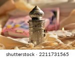 Small photo of sefer torah Torah scrolls A silver antique with a tour of the tablets of the covenant with the Hebrew letters. placed on a tallit and a sidur and a small candle