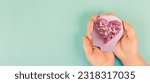 Small photo of Brain with heart of flowers, love and passion, self esteem and mental health care concept, positive thinking, creative mind