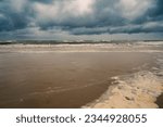 Small photo of Baltic sea beach landscape, coast at the island of Usedom in Germany, storm and rain over the brack water, high waves