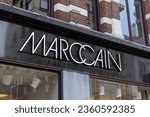 Small photo of The Hague, the Netherlands. 2 September 2023. Marccain logo sign. MARC CAIN an internationally successful German fashion label is a top brand in the field of women's fashion.