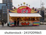 Small photo of Eindhoven, the Netherlands. 7 January 2023. Gebak stall. A pastry stall is a stall where fried dough dishes are prepared and sold, such as oil and raisin buns, Berliner buns, apple fritters and waffle