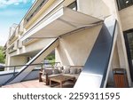 comportable teracce with awning and sofa