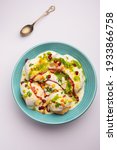 Small photo of Dahi vada or bhalla is a type of chaat originating from the Indian and popular throughout South Asia. It is prepared by soaking vadas in thick dahi or curd. selective focus