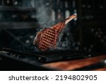 Small photo of Smoky Grilled Steak. Tomahawk Steak