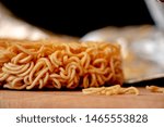 Small photo of Uncooked Noodle. The dry instant noodles are in the bag or cup, with flavoring powder and seasoning oil. The main ingredients are flour, starch, salt, sodium carbonate.