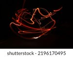 Small photo of Illusory and abstract red light trails