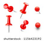 set of red push pins in...