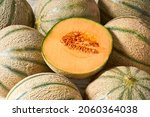 Whole and sliced ​​melon, honeydew melon or melon cantaloupe and food texture close up. Cantaloupe melon composition and design elements.