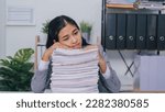 Small photo of stressed, mad, migraine, Young confident asian business woman office worker people working with stack of papers, unfinished documents of bookkeeping.