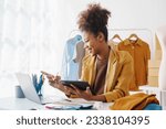 Small photo of Sell Clothes Online With Print-On-Demand, pretty african american clothing designer selling online start a sustainable fashion brand High-quality print on demand clothing. Fast shipping worldwide.