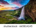 Seljalandsfoss - Seljalandsfoss is located in the South Region in Iceland right by Route 1. One of the interesting things about this waterfall is that visitors can walk behind it into a small cave.

