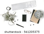Minimal flatlay with smartphone, candle, eyeglasses, notebooks, keyboard, paper clips, pen and succulent plants isolated on white background. Feminine workspace desktop top view. Mock up