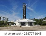 Small photo of Pontianak Indonesia, September 25, 2023 - Pontianak equator monument on a sunny day. The equator monument is a marker of zero degrees at the equator, and is located in the city of Pontianak