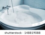a whirlpool bath full of foam ready to take a bath
