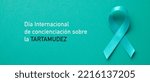 Small photo of an aquamarine awareness ribbon supporting those who stutter and the text international stuttering awareness day written in spanish, in a panoramic format to use as web banner