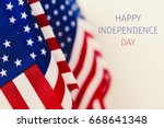 some american flags and the text happy independence day against an off-white background
