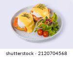 Small photo of Egg Benedict - toasted English muffins, ham, poached eggs, smoked salmon avocado and delicious buttery hollandaise sauce